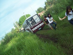Philwomenian leaving the bus which was stuck